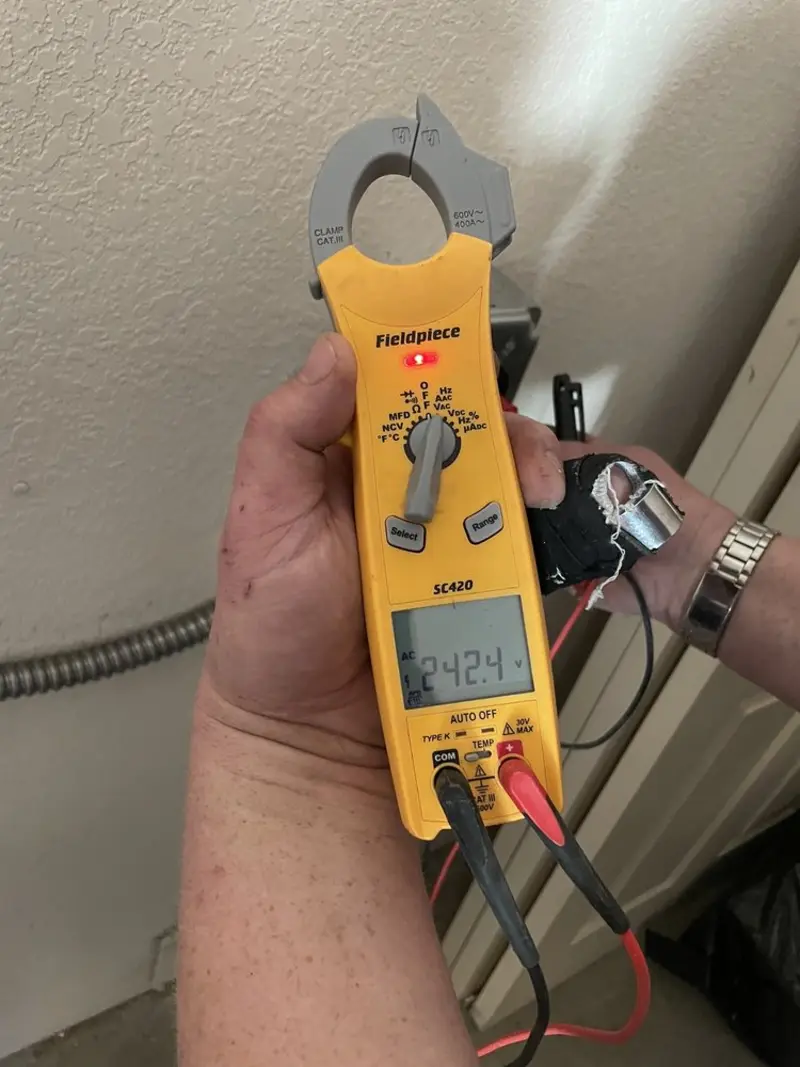 Voltage testing with clamp meter during Outlet Installation in Five Corners